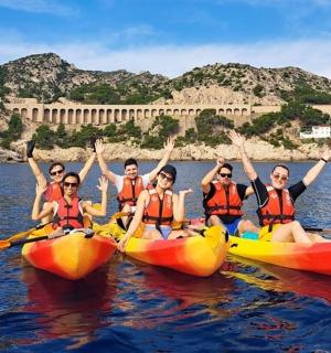 a group of people in kayaks on the water