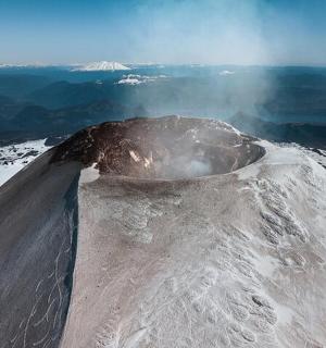 a snow covered mountain with snow on top of it