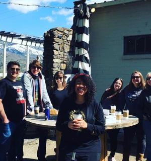 a group of people posing for a picture at a table