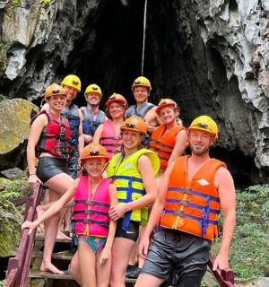 a group of people posing for a picture on a raft