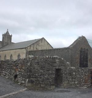 an old stone church with a glass dome
