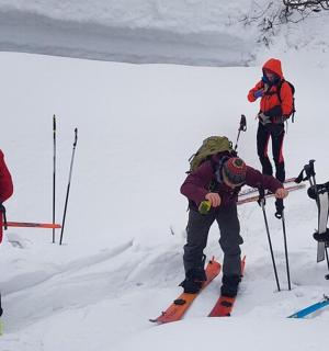 a group of people on skis in the snow