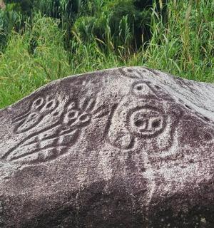 a rock with a face painted on it