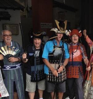 a group of people dressed in costumes posing for a picture