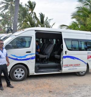 a man standing in front of a white van