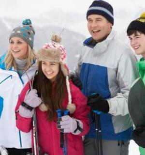 a group of people posing for a picture in the snow