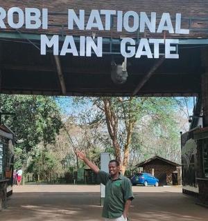 a man is standing in front of a main gate