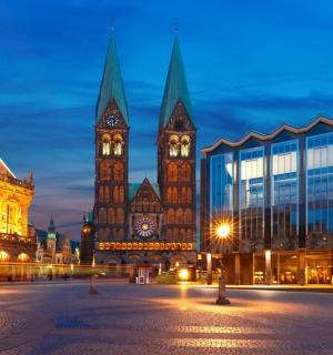 a city with a clock tower and a building