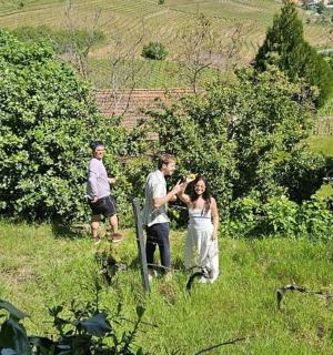 a man and a woman standing in a field