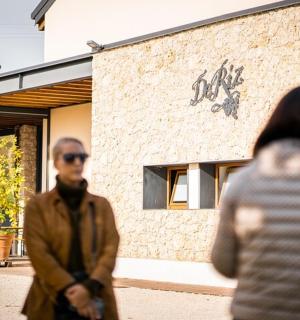 a group of people walking in front of a building