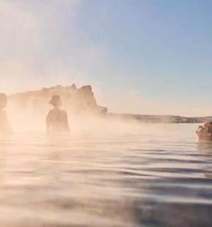 a woman standing in the water at