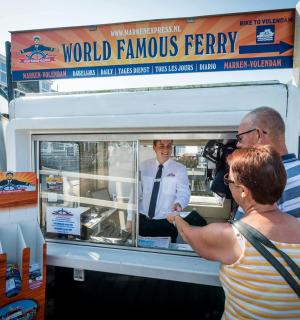 a man and a woman standing in a food truck