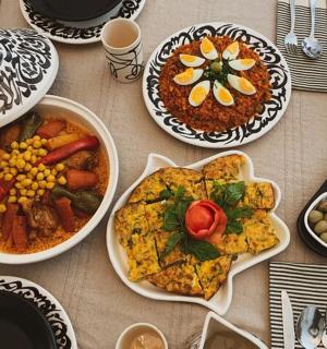 a table with many plates of food on it