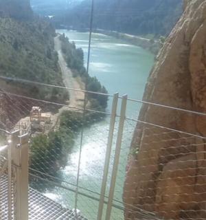 a view of a suspension bridge over a river