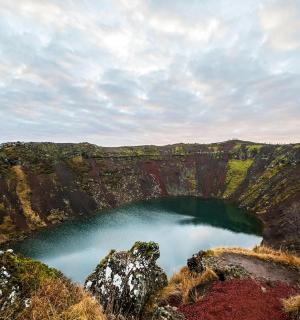 a view of a blue lake in a canyon