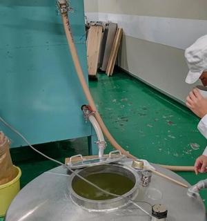 two chefs standing next to a table with a mixer