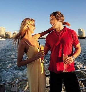 a man and a woman standing on a boat