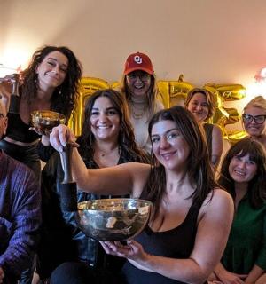 a group of people are posing for a picture