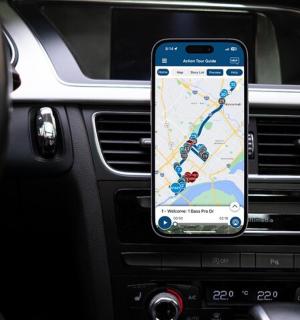 a cell phone on the dashboard of a car