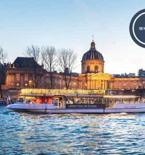 a boat on the river in front of a building