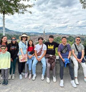 a group of people are posing for a picture