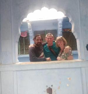 a group of three people standing in a play house
