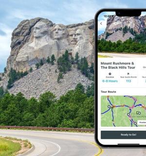 two phones are on a road with a mountain