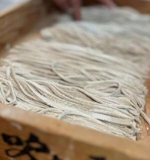 a wooden box with a pile of wool