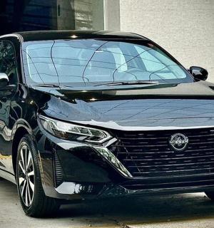 a black car parked in front of a building