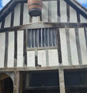 a black and white building with a barrel