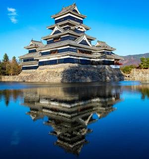 a large building sitting on top of a body of water