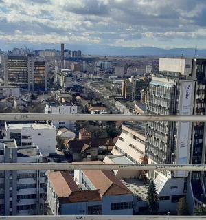 an aerial view of a city with tall buildings
