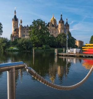 a boat tied to a dock in a body of water