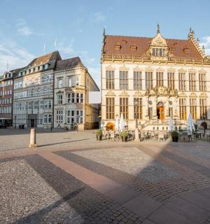 a group of buildings in a square in a city