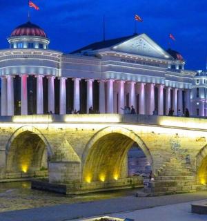 a large building with a bridge in front of it