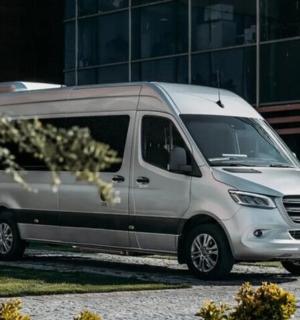 a white van parked in front of a building