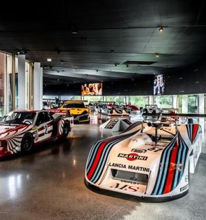 a group of race cars parked in a room