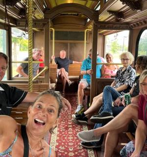 a group of people sitting on a train
