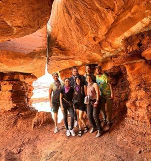 a group of people standing in a cave