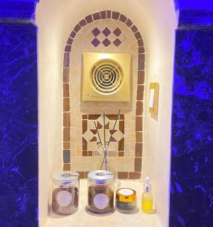 a bathroom with a tile wall with angth