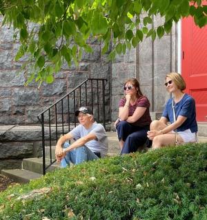 a group of people sitting on the steps