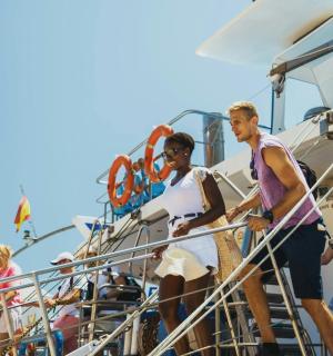 a group of people standing on a boat