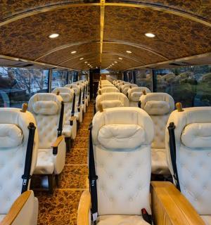 a bus with rows of seats on the water