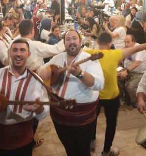 a group of men playing instruments in front of a crowd