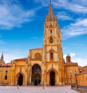 a large building with a tower with a clock on it