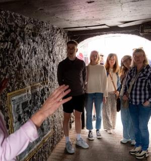 a group of people standing in a tunnel