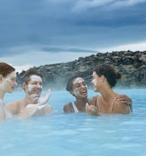 a group of people swimming in the blue lagoon