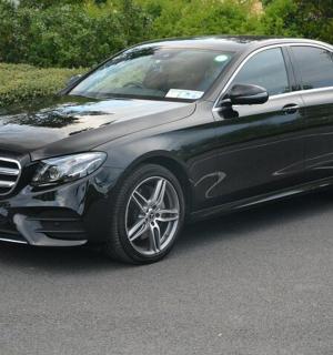 a black car parked in a parking lot