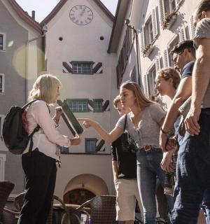 a group of people standing in front of a building
