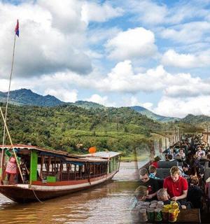 a group of people on a boat in a river